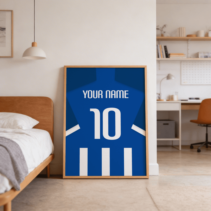 Framed Football Shirt Poster in Blue and White Stripes with White Number leaning against a bedroom wall near a wooden bed