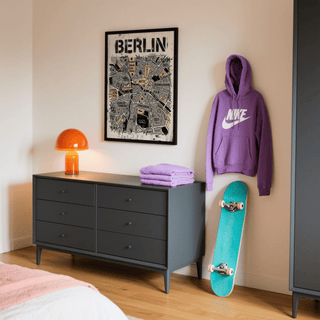 Berlin City Map wall art with abstract grey and yellow districts above a grey dresser with an orange lamp