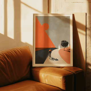 Framed Cycling Landscape Art Print of cyclist on road with orange geometric shapes leaning on a brown leather sofa