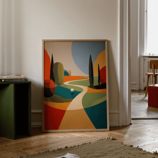 Print leaning on a floor showing colourful golfing wall art in abstract minimalist style with books nearby
