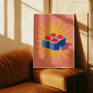 Sushi Poster print with blue and red sushi rolls on a pink background leaning on a tan leather sofa