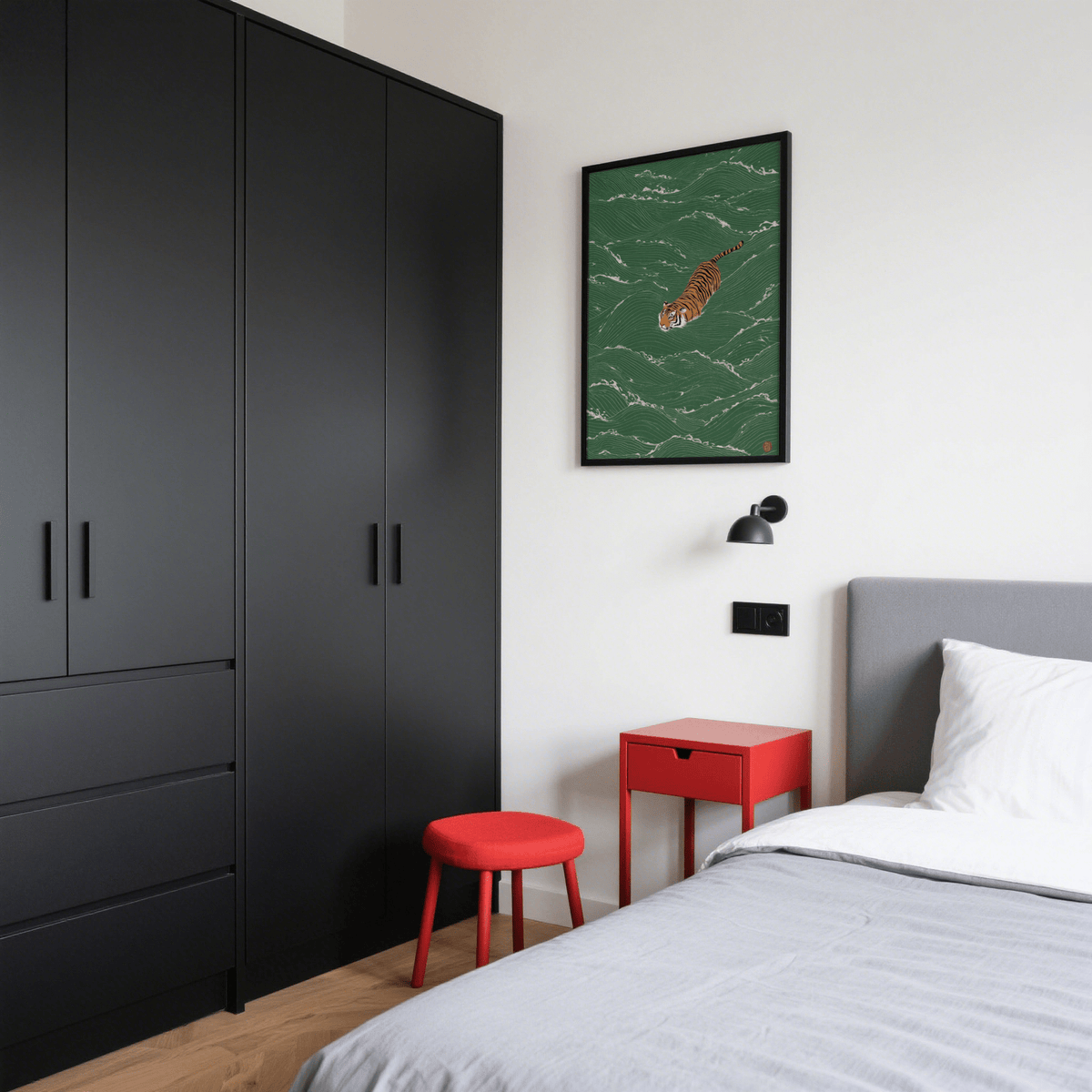 Wildlife wall decor showing a minimalist illustration of a swimming tiger in green water above a red stool in a bedroom
