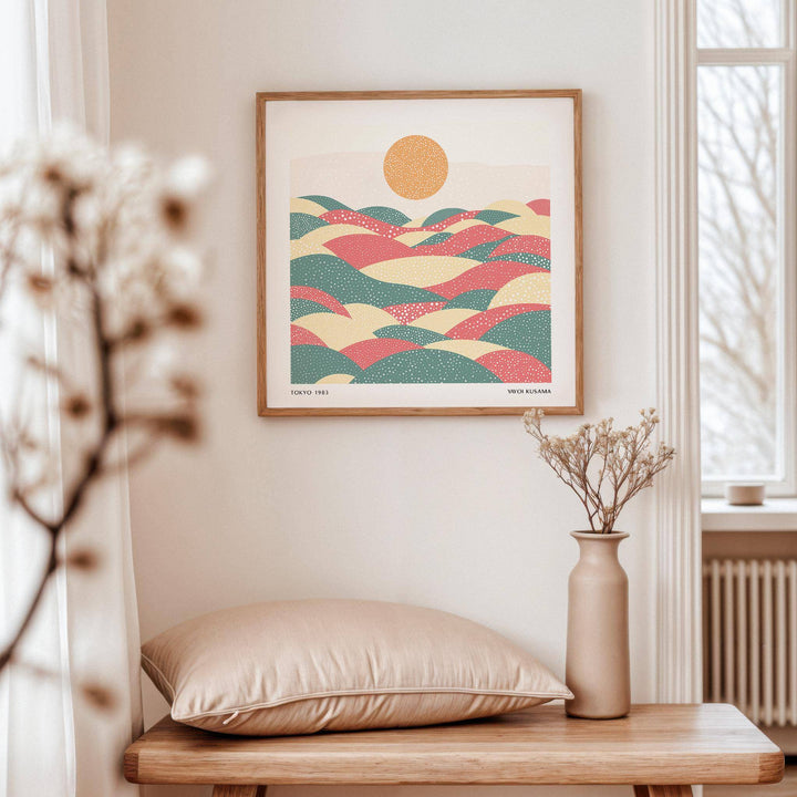 Pastel Abstract Artwork framed print of abstract hills with dots above a wooden bench with cushion and vase
