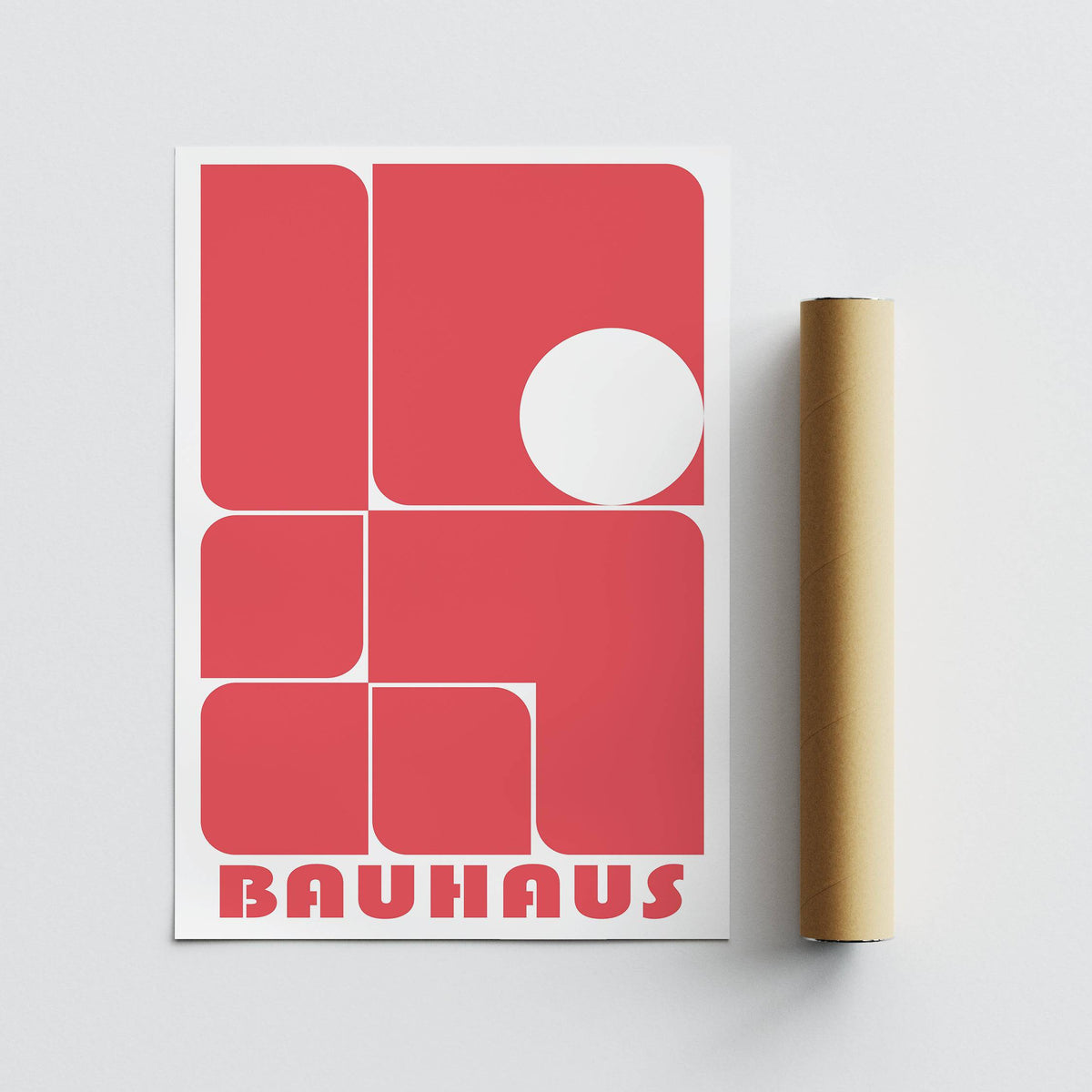 Red wall art decor with red rounded rectangles and a white circle plus packaging tube
