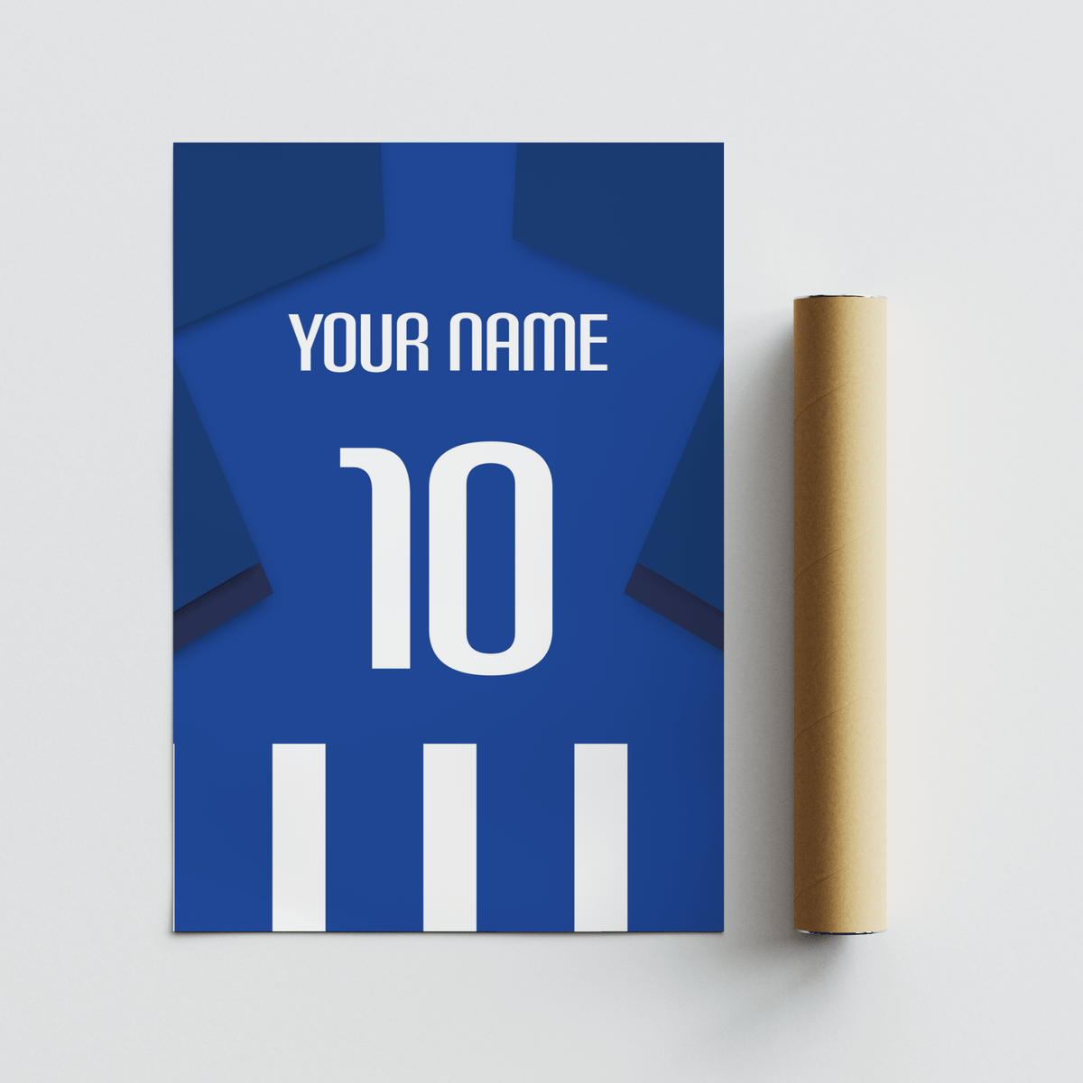 Blue and white striped football shirt poster with dark blue sleeves beside a cardboard packaging tube on a white surface