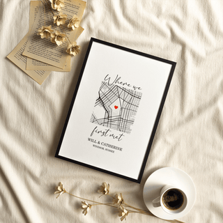 Framed Heart on Map Print with a red heart and handwritten style text beside dried flowers and coffee cup