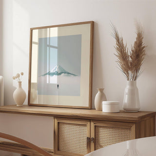 Framed Japan Travel Poster of Mount Fuji with snow and a lone figure leaning on a wooden sideboard with vases