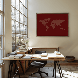 World Map Wall Poster framed print with red background and beige dotted world map above a work desk in a bright room