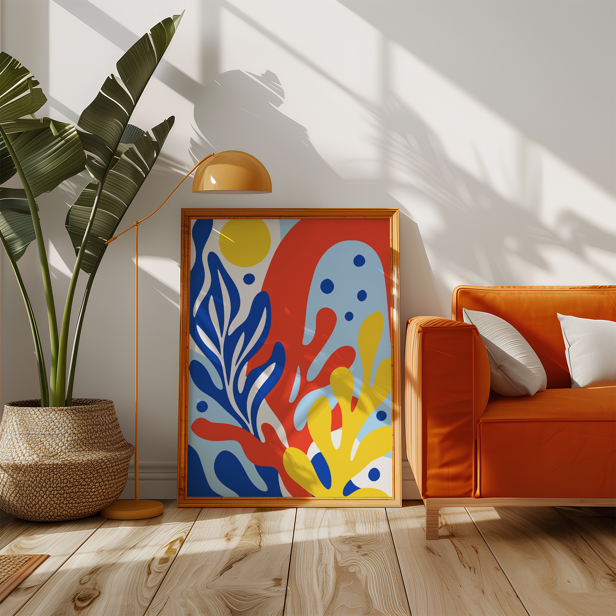 Cobalt, red and yellow sea shapes beside an orange sofa in a sunny living room