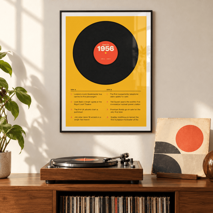 Black vinyl record print with a 1956 label on a wall in a lived in room
