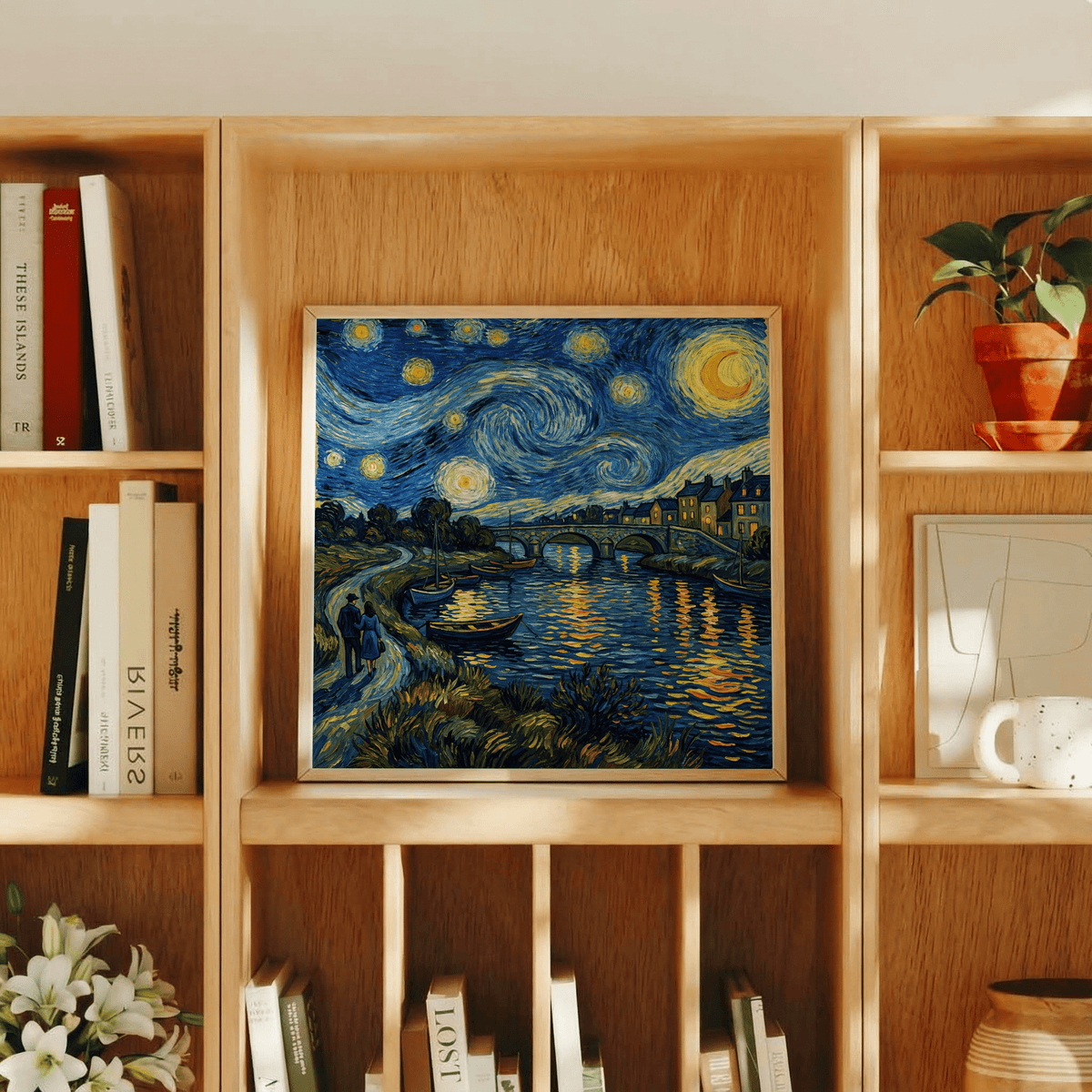 Print on a shelf of Vincent Van Gogh Poster with blue and yellow starry night river scene and a book beside it