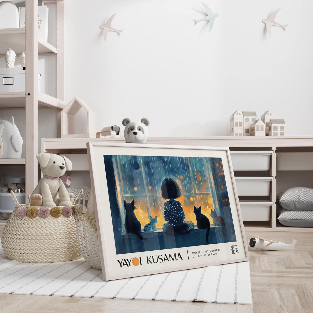 Cat wall decor print leaning on the floor with a toy dog and children's shelves nearby