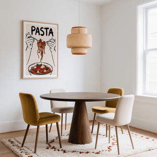 Pasta Art Print hung above a dining table with mustard and cream chairs and white walls