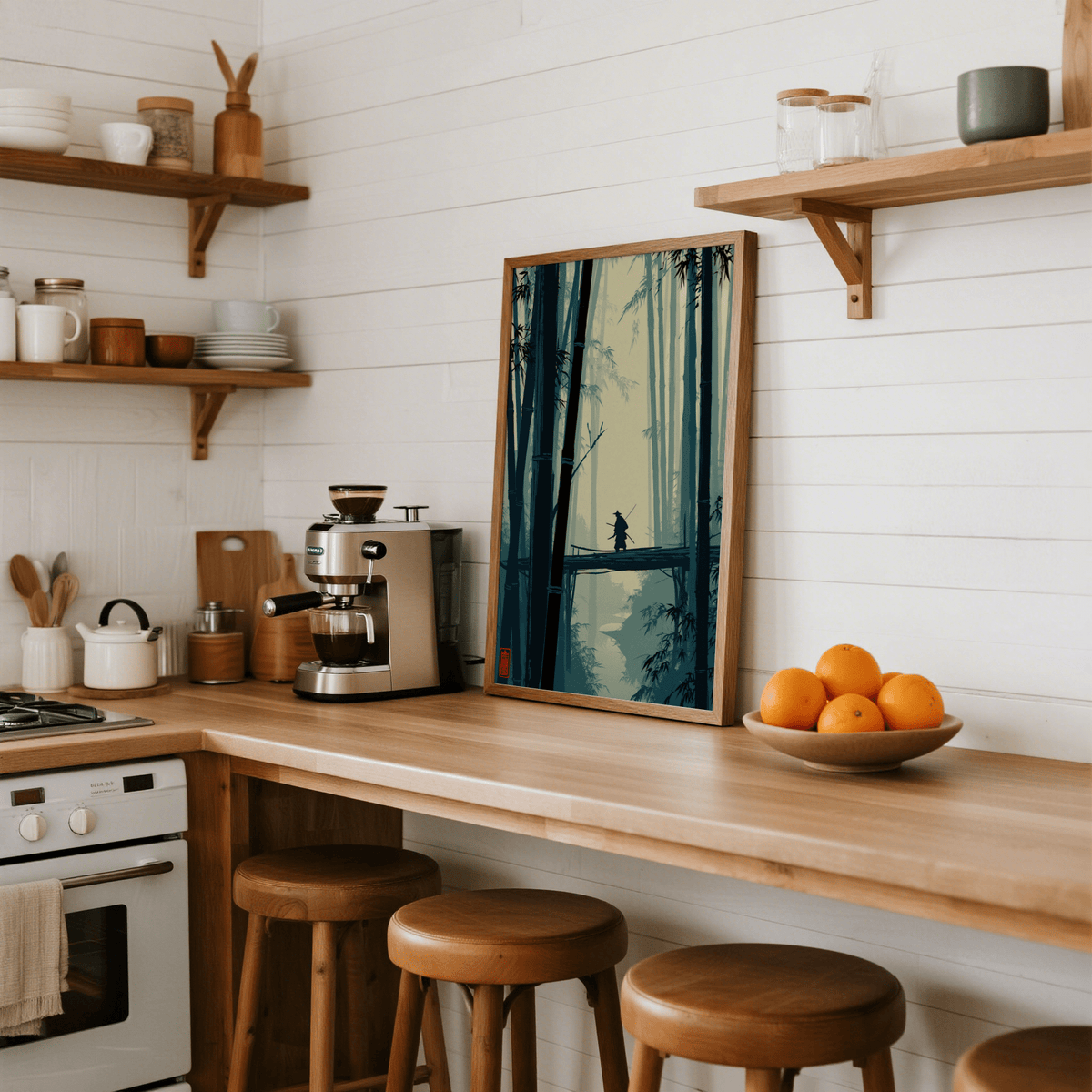 Japanese Bamboo Art Print leaning on a kitchen counter with a wooden bowl of oranges nearby