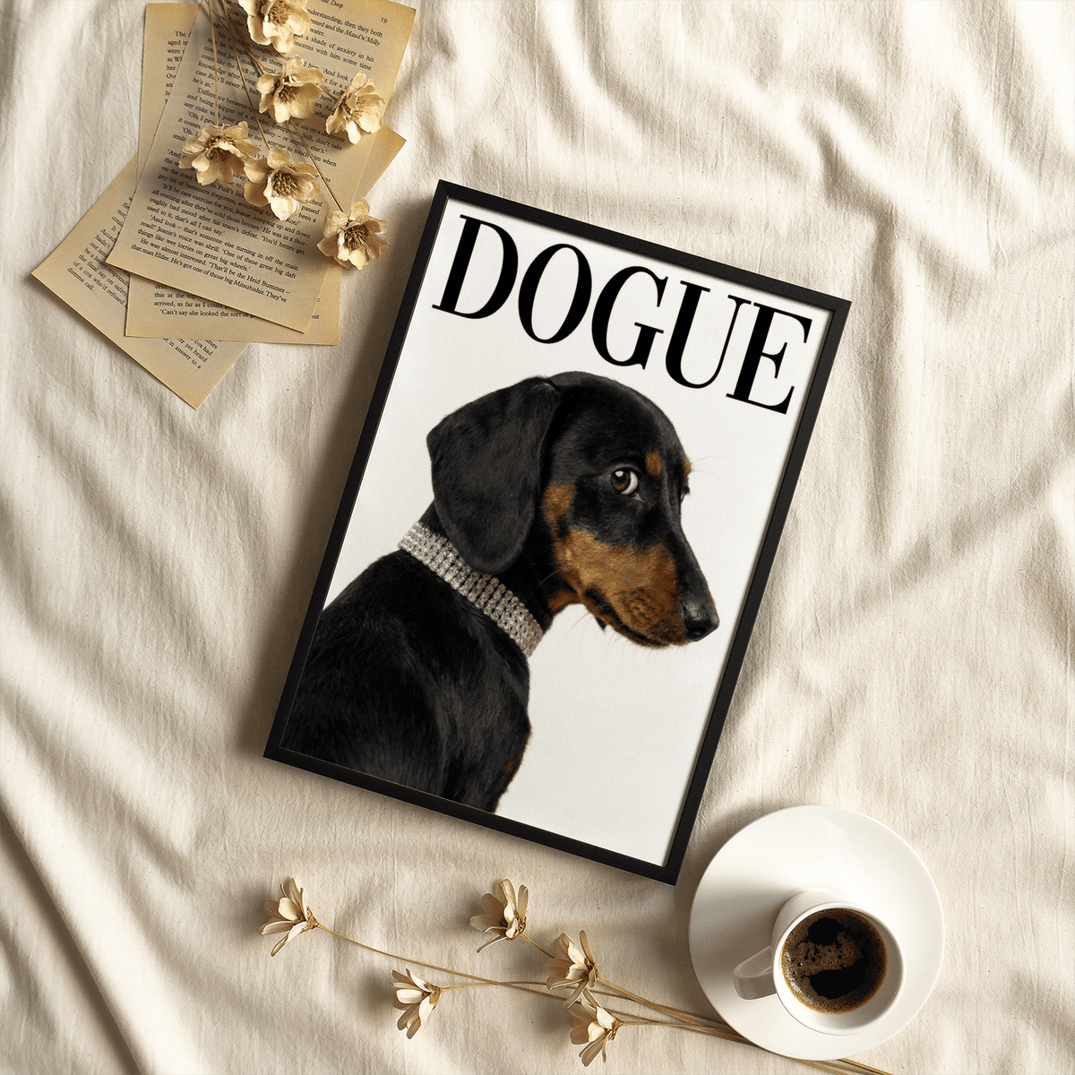 Framed Dachshund art print showing a black and tan dog with a collar lying on cream fabric beside coffee and dried flowers