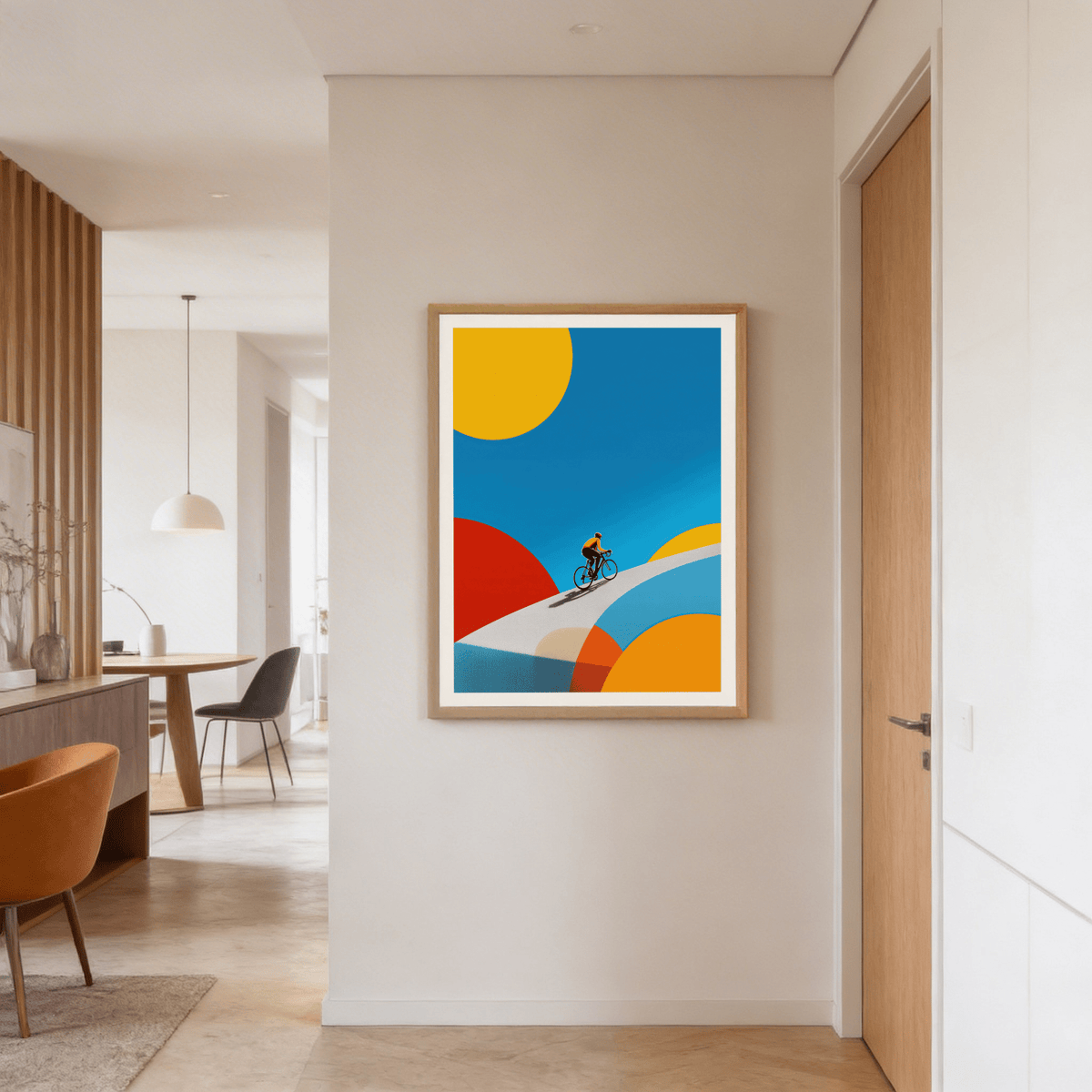 Abstract Bike Poster framed print of a cyclist on a minimalist colourful road hung on a hallway wall with a door nearby
