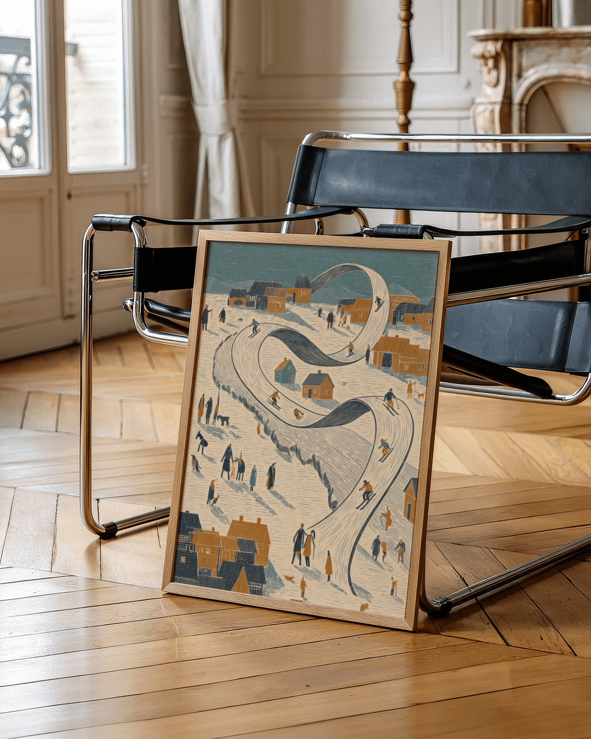 Framed Snow Scene wall art of skiers on a looping ski slope leaning against a chair on a wooden floor