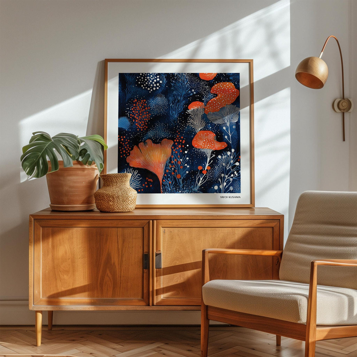 Unique Living Room Wall Art with orange and blue abstract floral shapes above a wooden sideboard with plants
