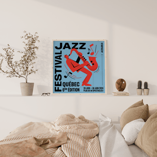 Music wall art of a red saxophone player with blue background leaning on a shelf with a plant