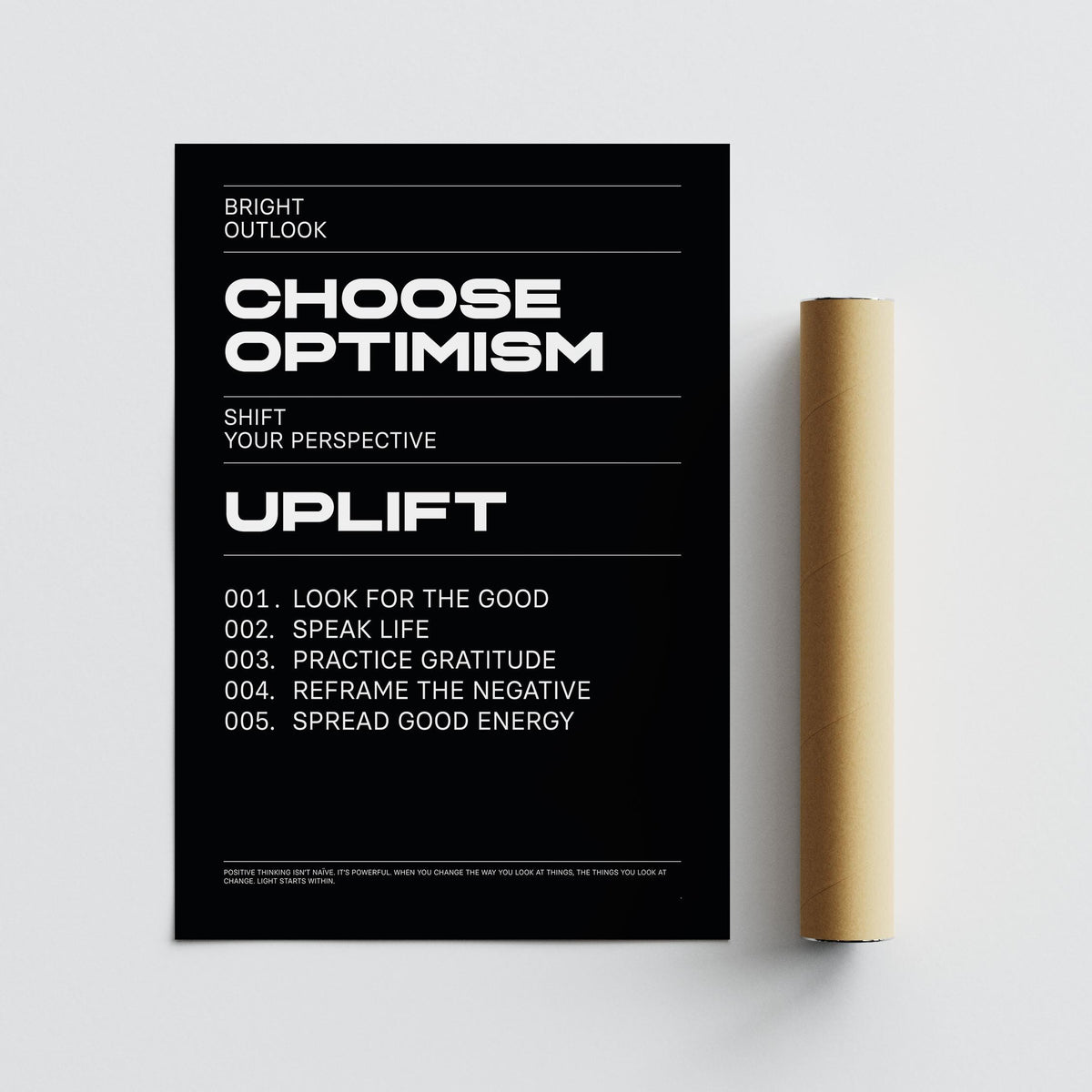 Affirmation Print with bold white text on black background next to a brown packaging tube