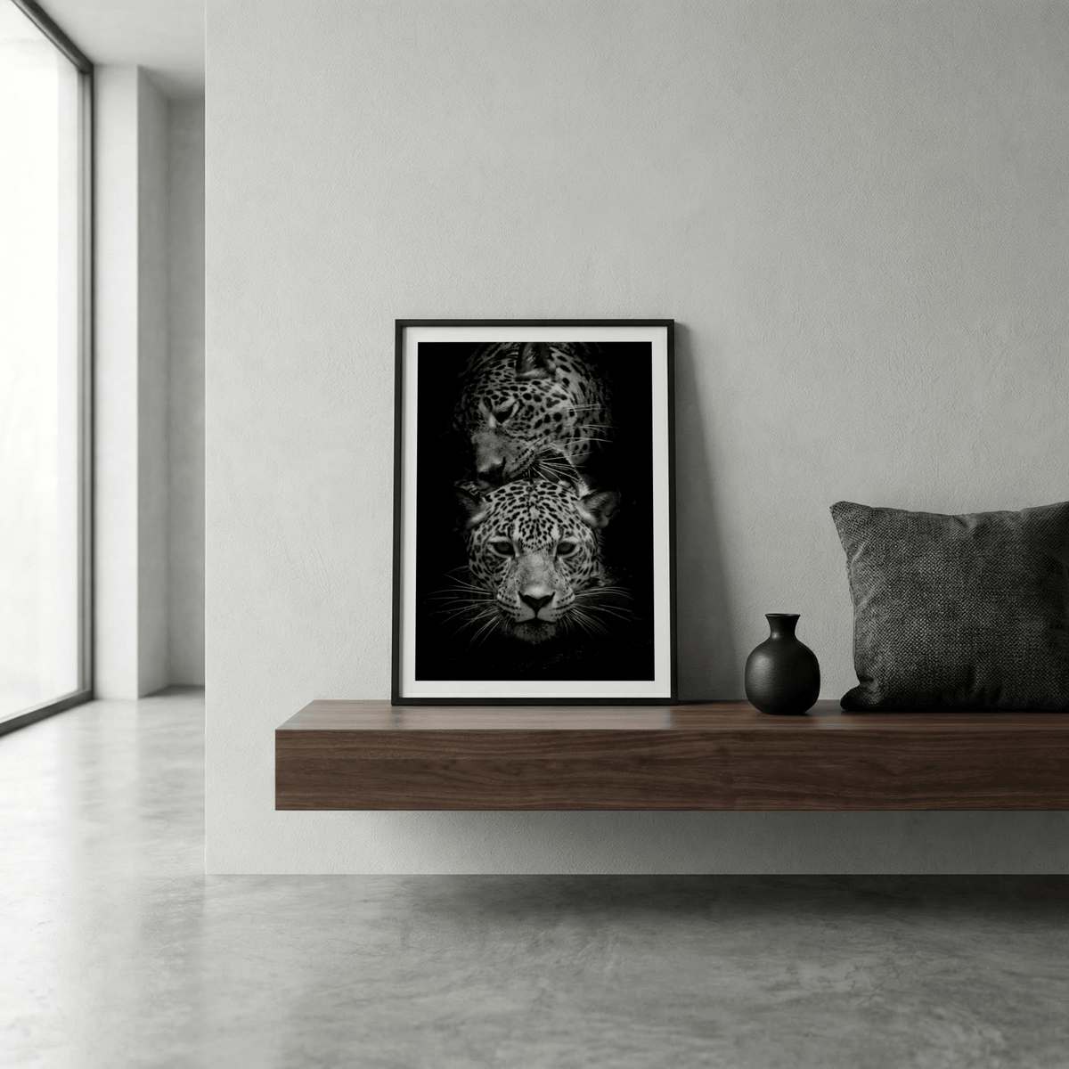 Leopard photography print of two leopards in black and white leaning on a wooden shelf with a dark vase