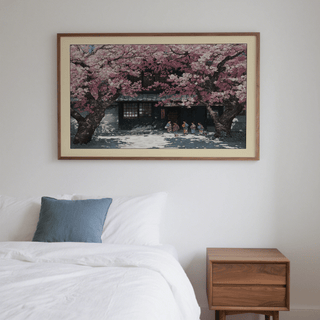 Hasui Kawase Cherry Blossoms wall art of pink cherry blossom trees with children above a bedside table in a bedroom