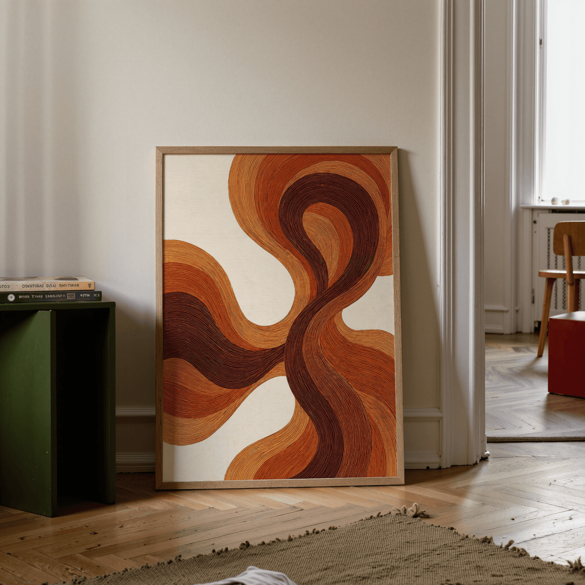 Organic Line Poster leaning on floor with flowing lines in brown and beige beside a green stool