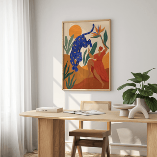 Mystical Blue Leopard wall art with orange sun and green leaves above wooden desk with plant