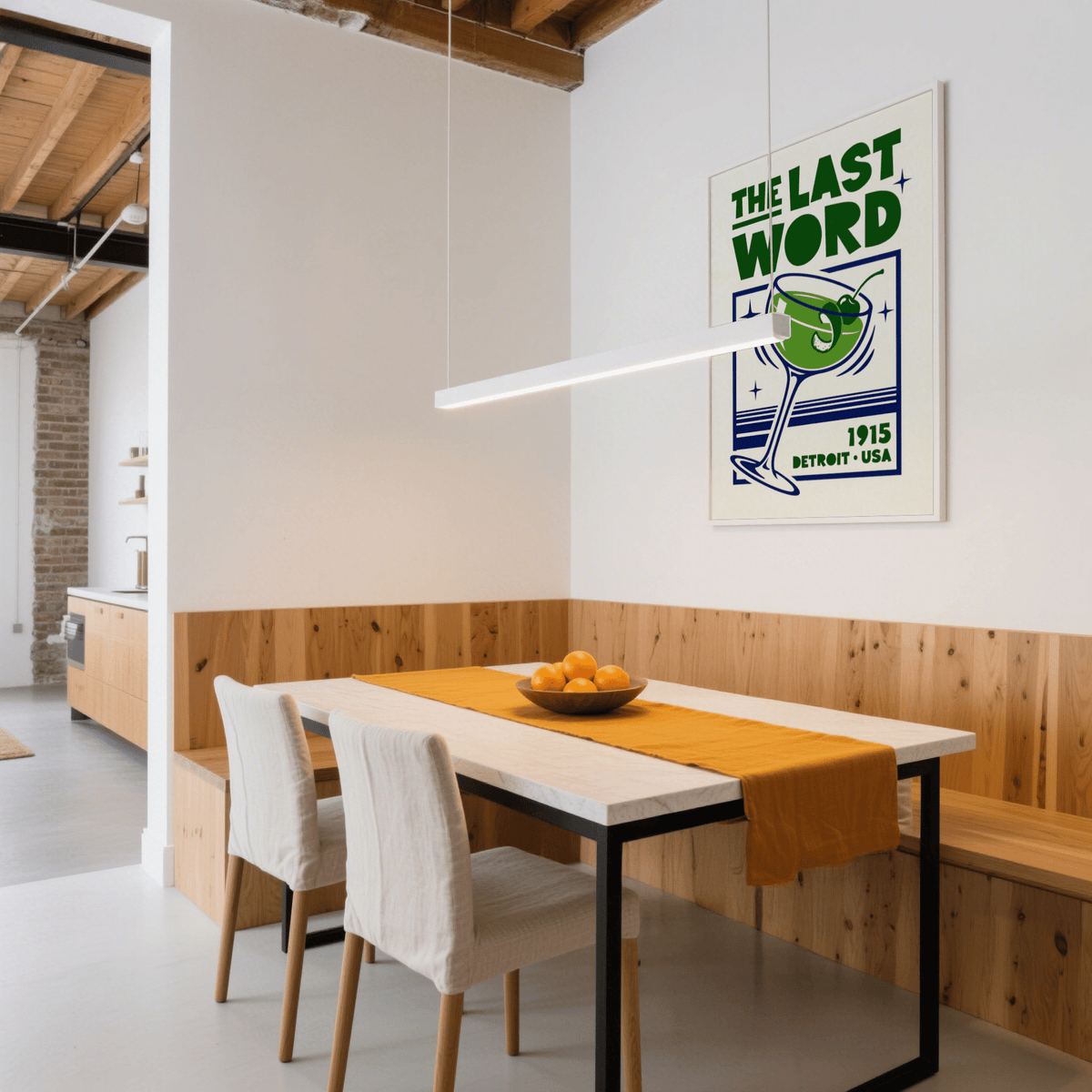 Cocktail art print of a green last word cocktail hung in a dining room above a table with an orange runner
