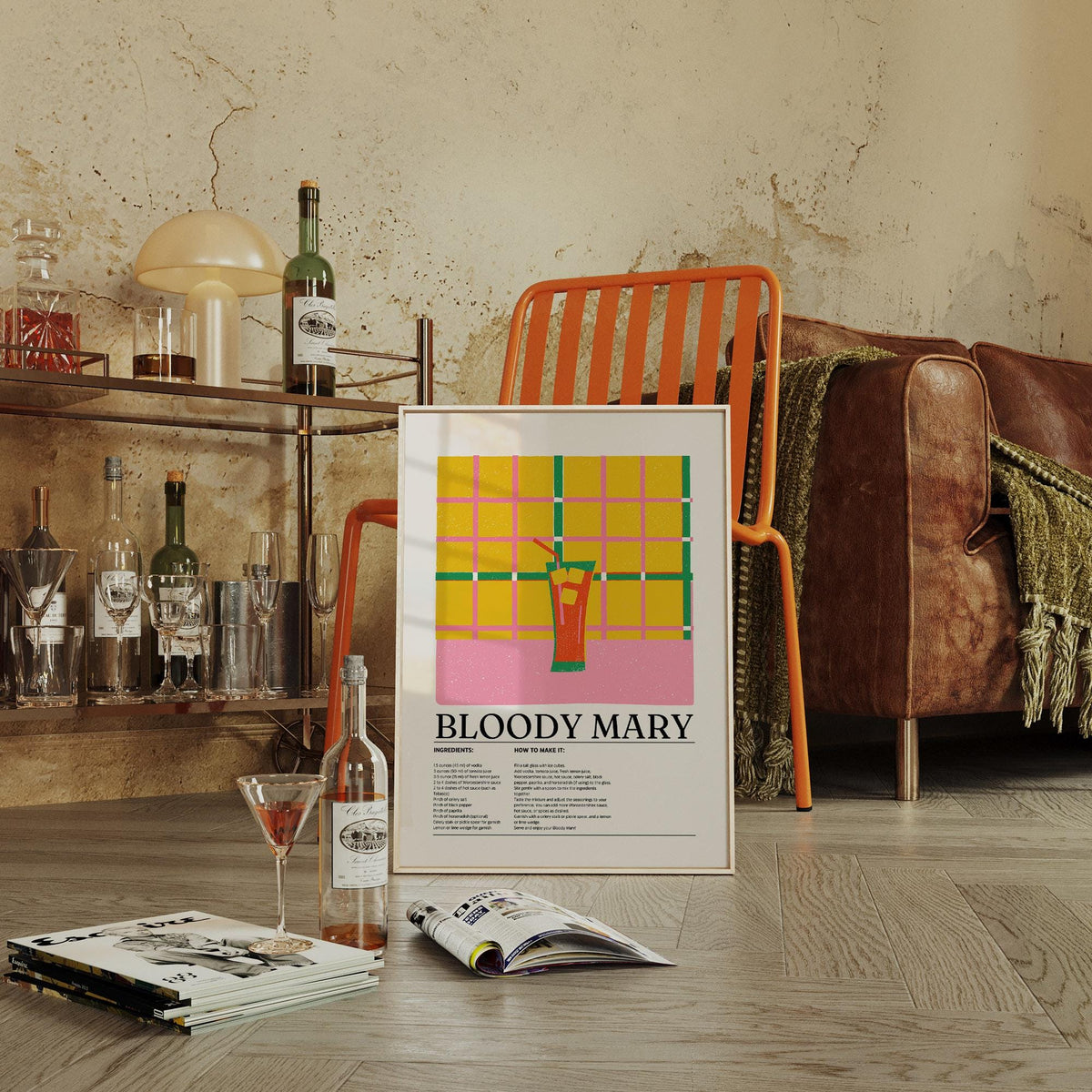 Retro Drink Poster print leaning on an orange chair with brown sofa and drinks shelf nearby