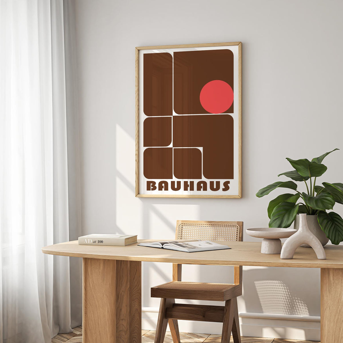 Wall Art for Offices hanging above a desk with green plant and brown geometric shapes with a red circle