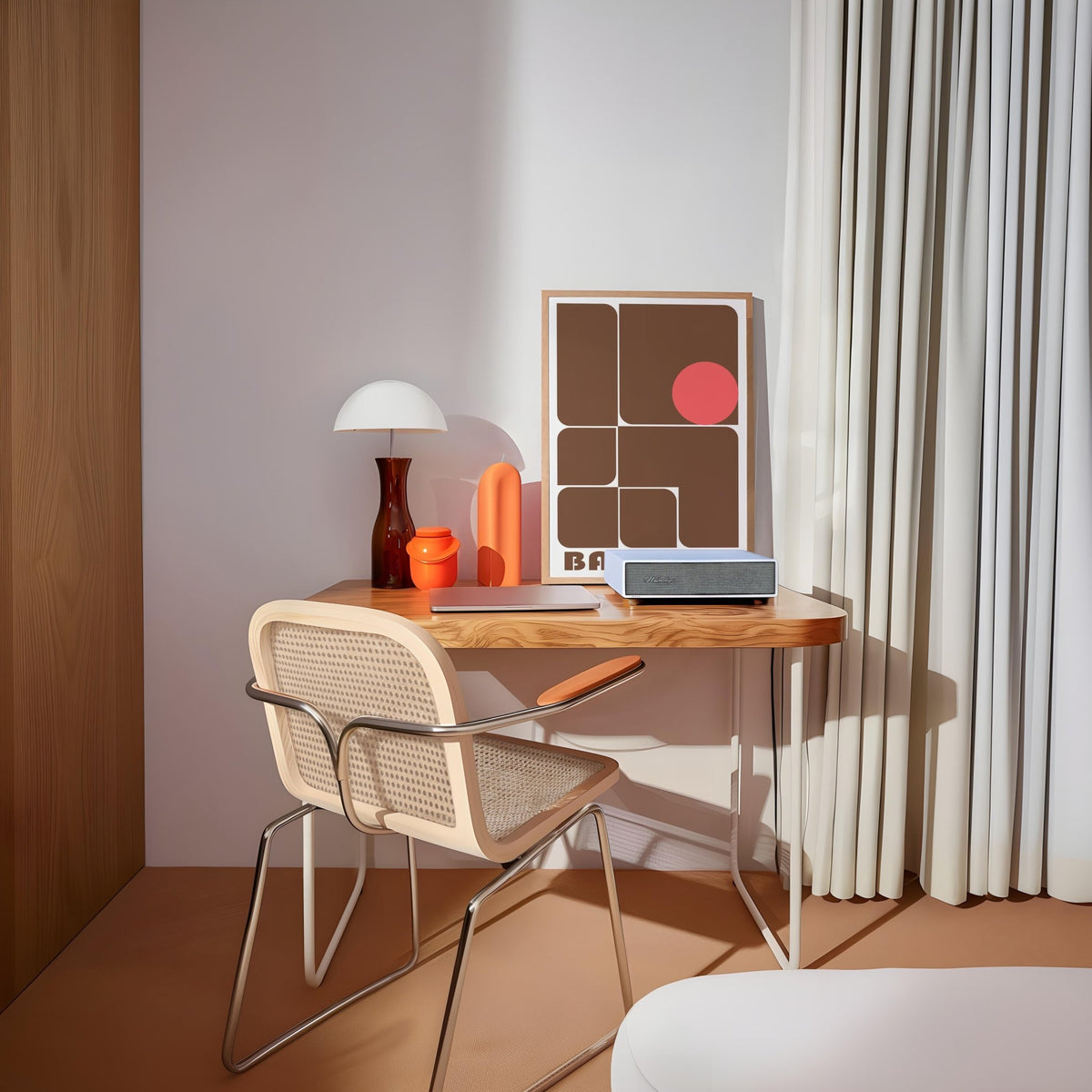Wall Art for Offices leaning on a wooden desk featuring brown geometric shapes and a red circle with a lamp nearby