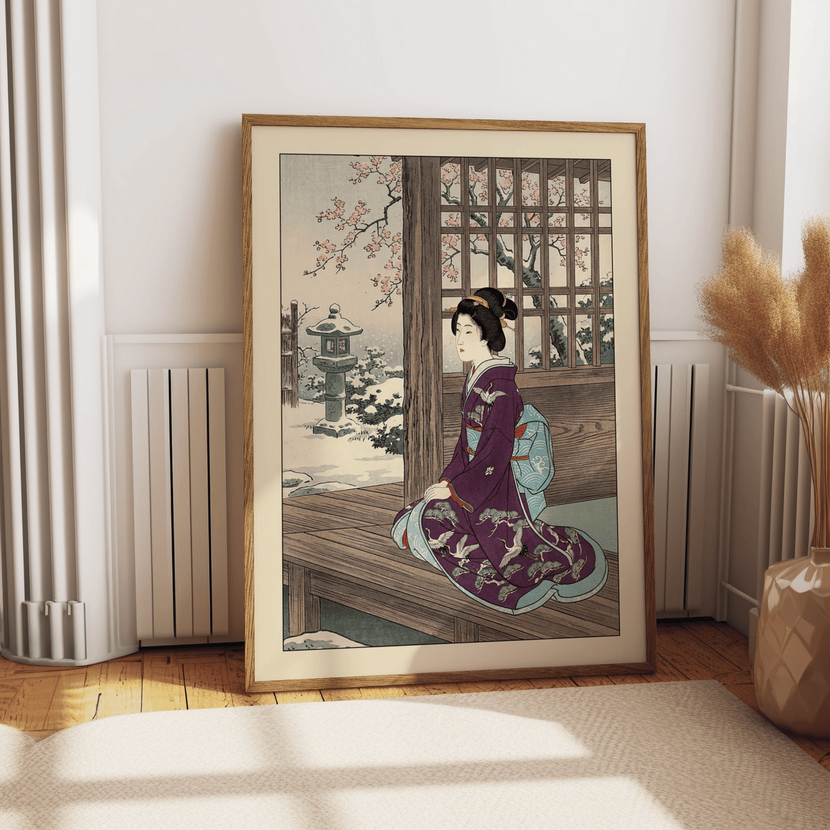 Hasui Kawase Geisha Print leaning on a wooden floor with a beige vase and pampas grass nearby
