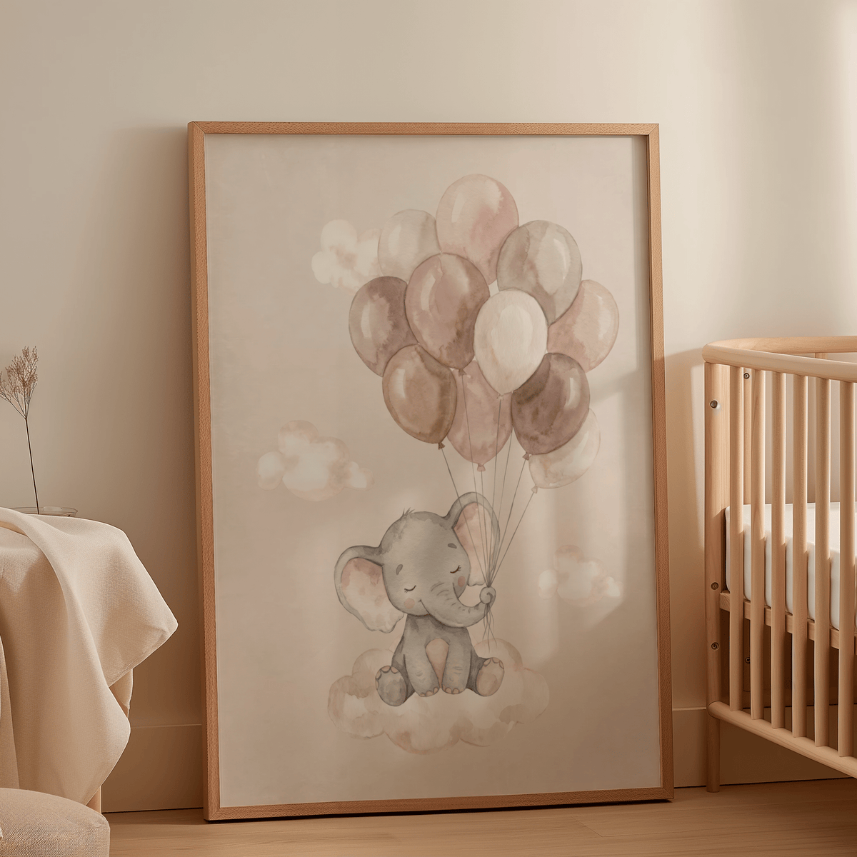 Print leaning on a floor against a wall of a baby elephant with balloons in soft pastel colours in a nursery