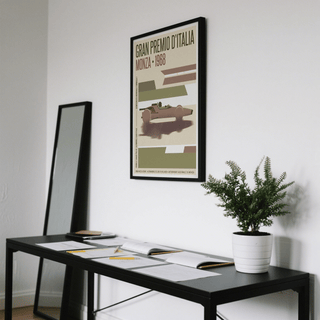 Monza Grand Prix Poster on wall above black table with open books and a potted plant