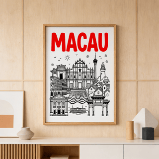 Macau Travel Art framed print with black and red illustration on a wall above decorative vases