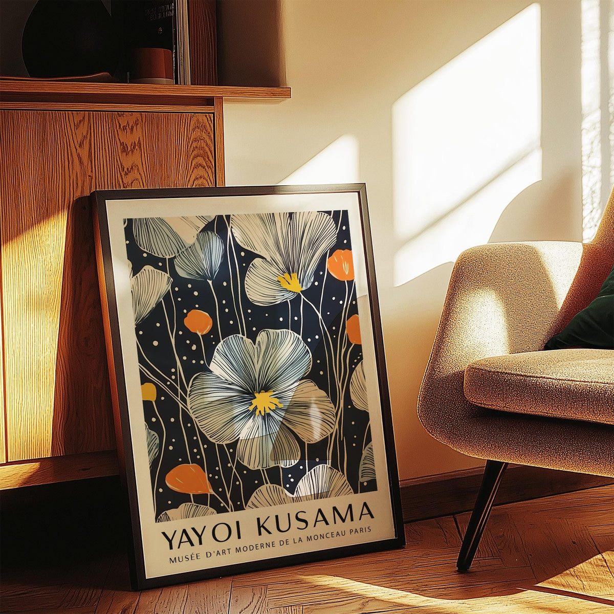 Framed Large Flower Wall Art leaning on a wooden cabinet with cream and orange blooms in natural light