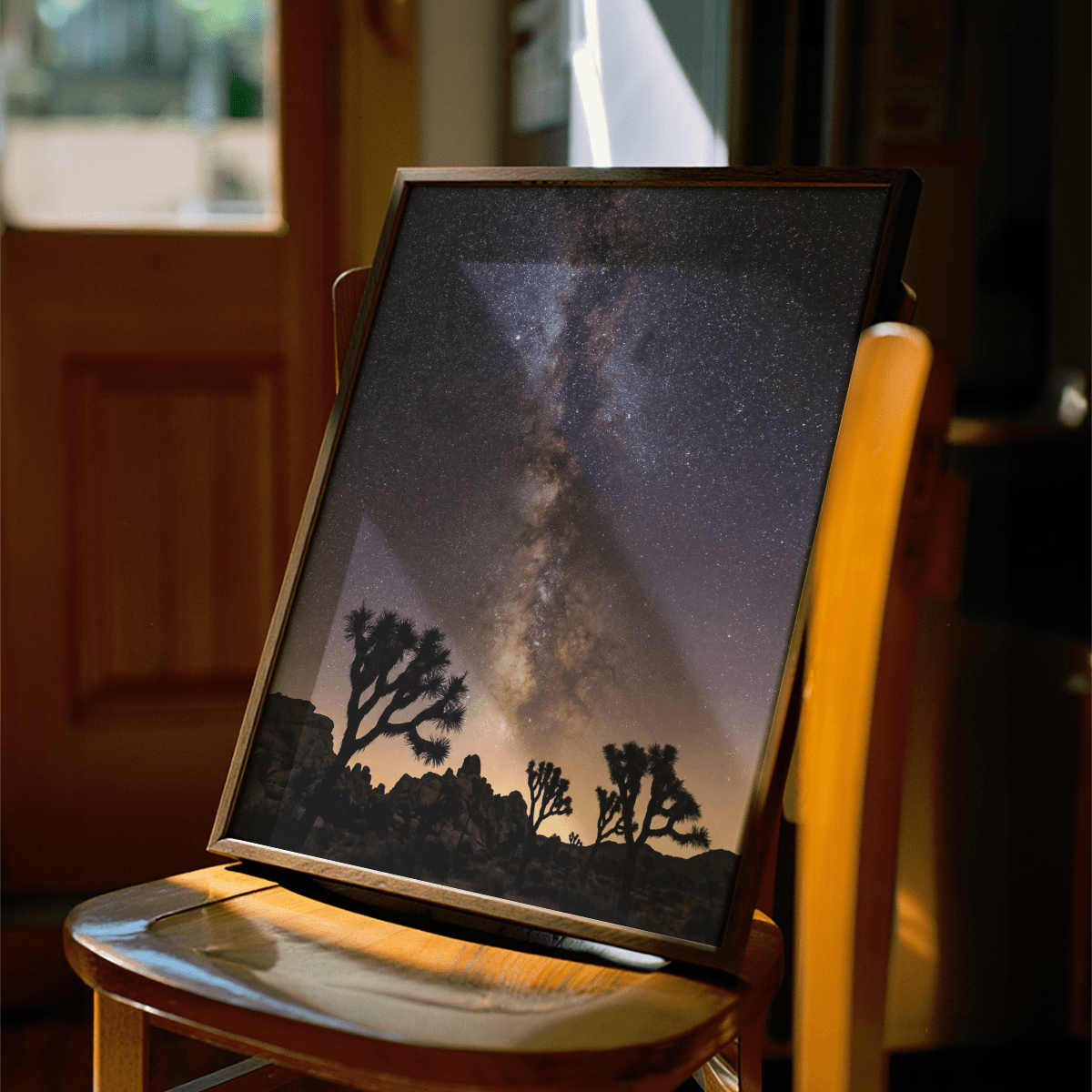 Framed Night Desert Poster with milky way over desert trees on a wooden chair