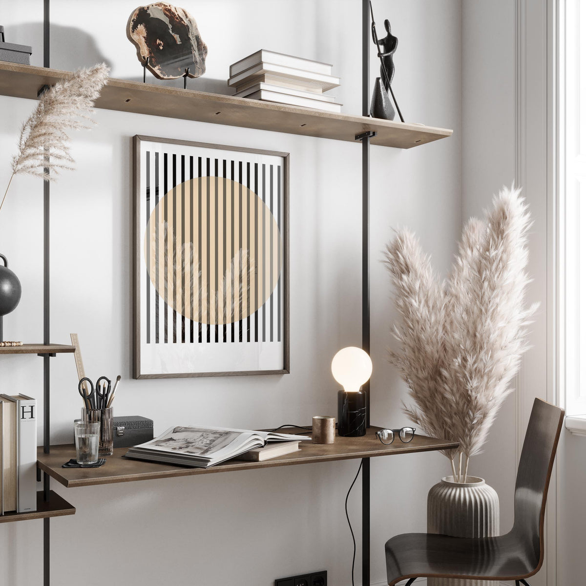 Office Posters print with beige circle and black vertical stripes above a wooden desk with a lamp