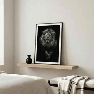 Black Lion Art Print leaning on a wooden shelf with a black vase in a bedroom