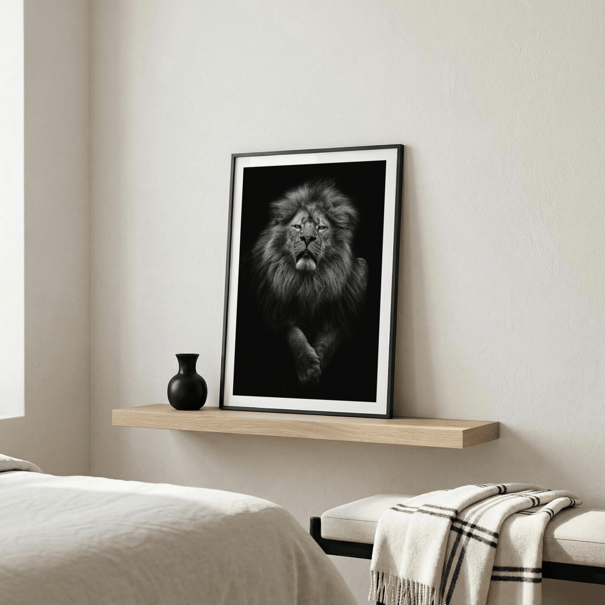 Black Lion Art Print leaning on a wooden shelf with a black vase in a bedroom