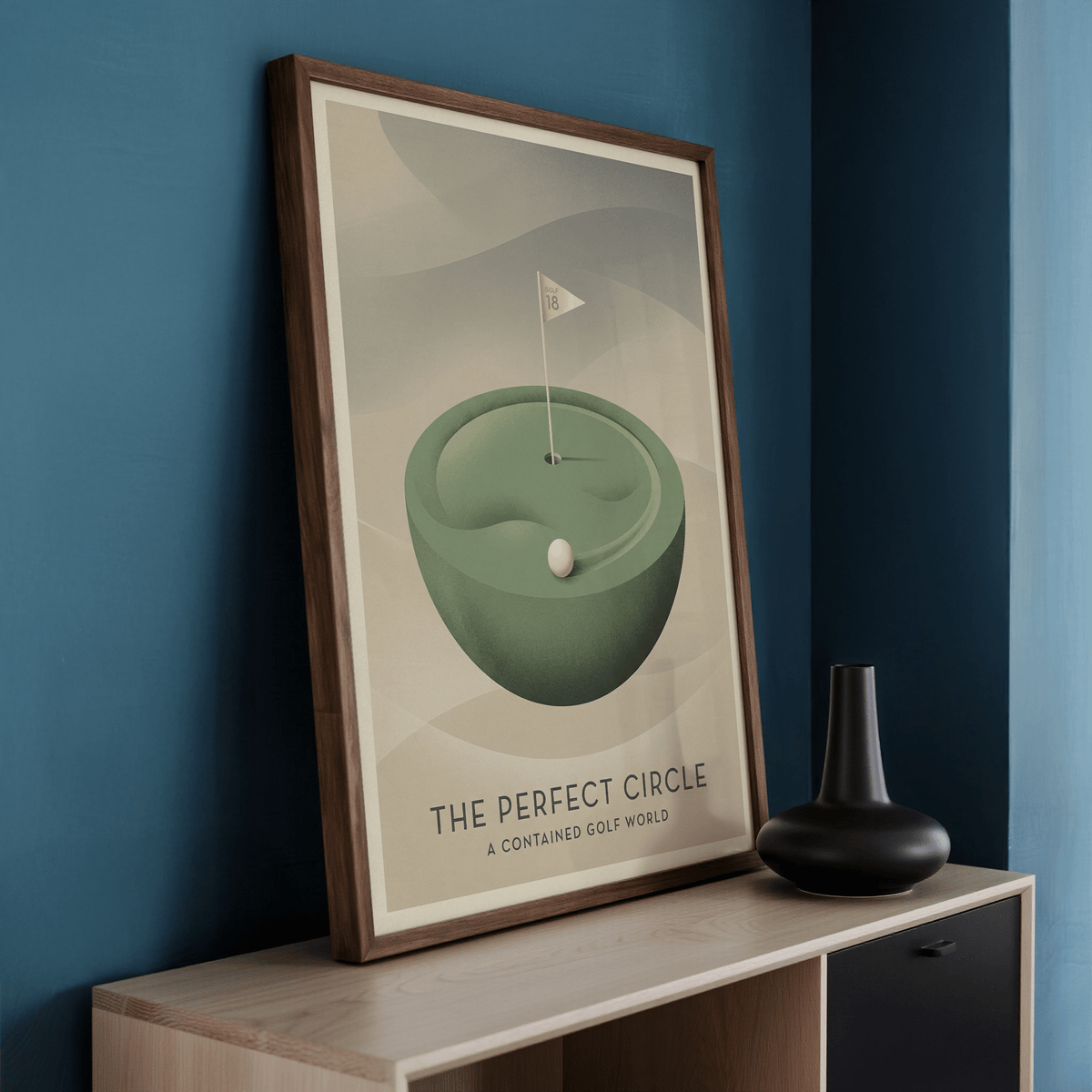 Framed Golf Art Print of a green miniature golf hole with a flag leaning on a sideboard with a black vase