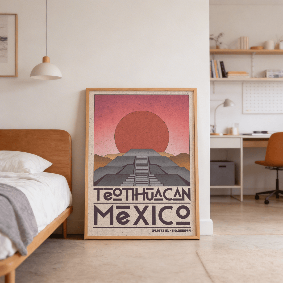 Teotihuacan wall art leaning on floor beside a wooden bed with orange sun and grey pyramid