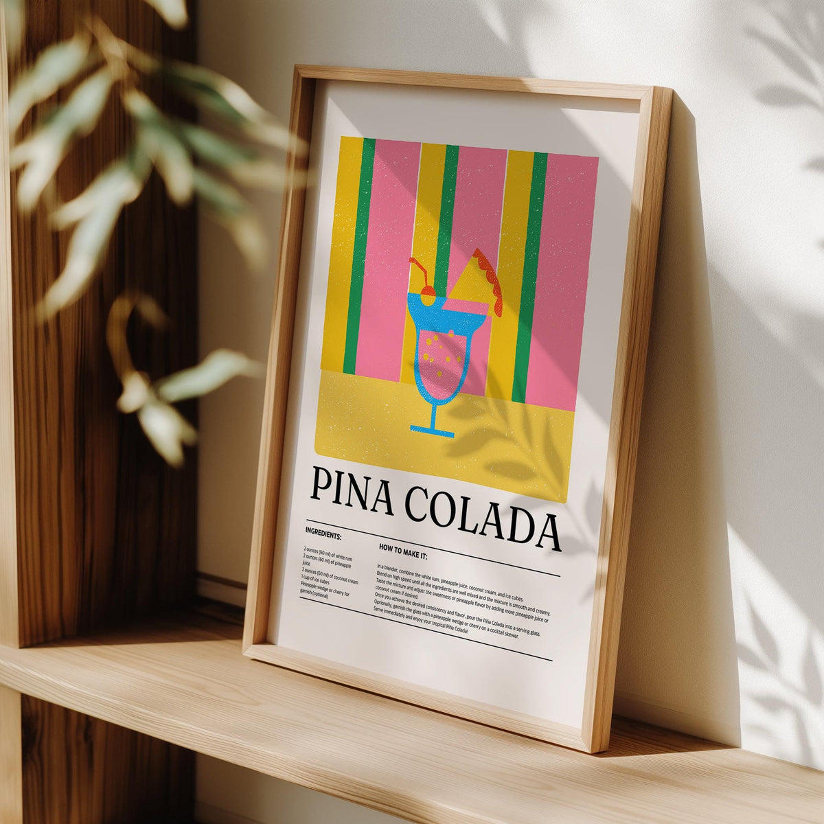 Print leaning on a shelf with piña colada cocktail artwork in bright colours and minimalist style