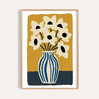 Framed art print flowers with cream flowers and blue striped vase against mustard background