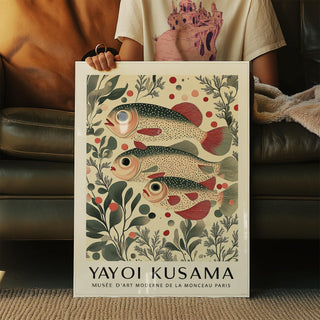 Framed wall art of fish showing a redfin trio with botanical illustration style held by person