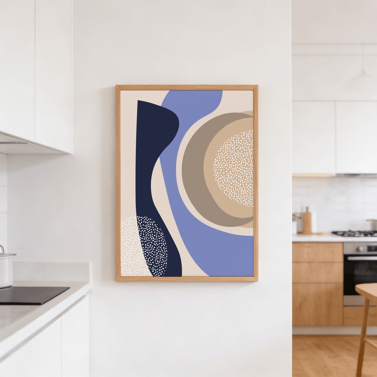 Modern Poster Design hanging on a white kitchen wall abstract organic shapes in blue beige and navy