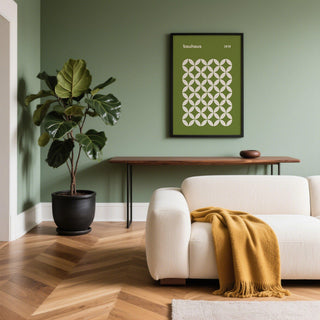 Print on a wall in a living room with a green circle petal pattern and a large green plant nearby