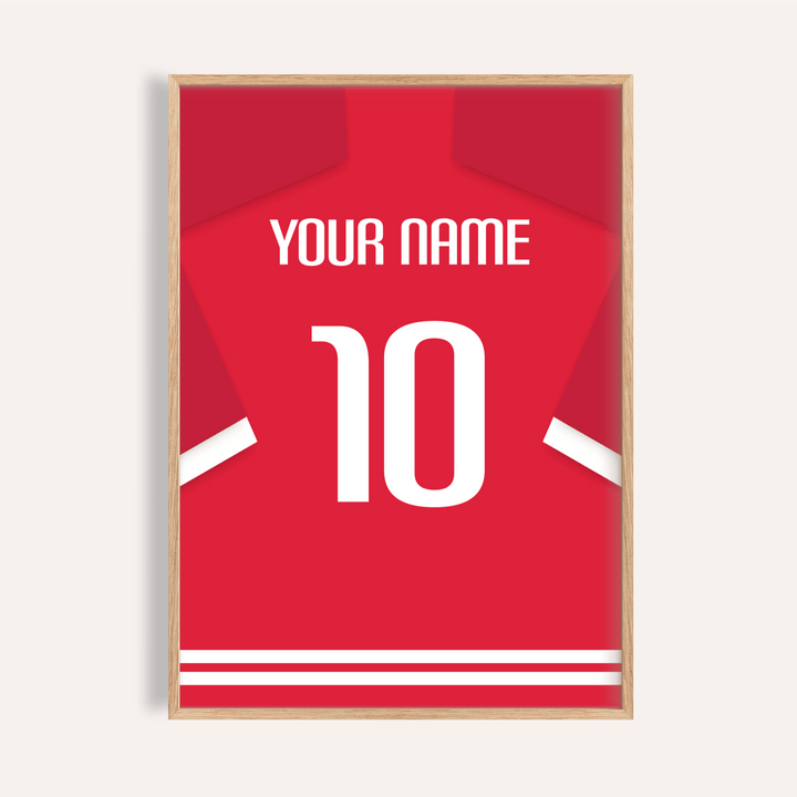 Framed close-up of a football shirt poster in red with white number 10 and typographic style