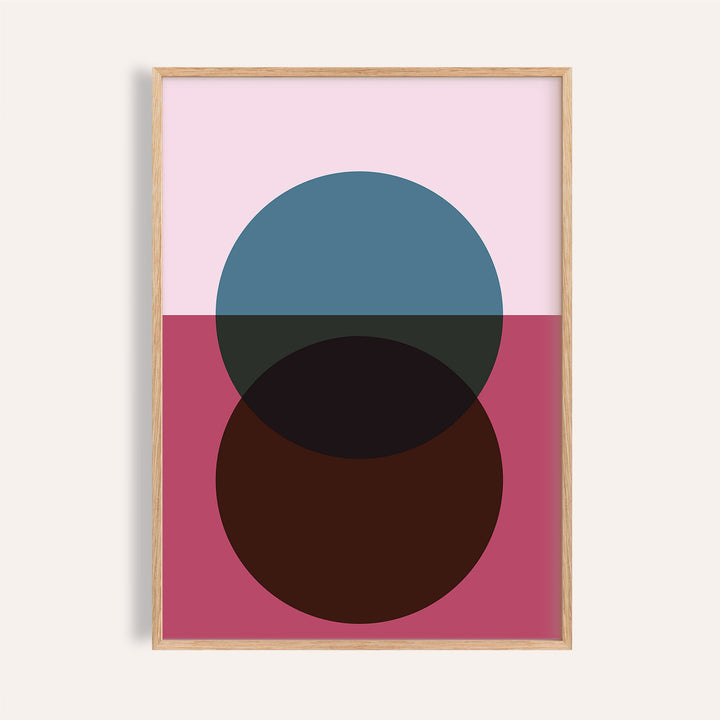 Framed purple wall art of overlapping minimalist circles in blue and brown on pink background